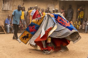 Benin - Village of Minifi, near Dassa. Voodoo ceremony of Egun masks. Egun masks represent the spirits of the deceased and according to the locals they “are” the deceased. The men wearing the masks representing Egun are initiates of the cult.