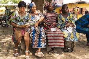 Ouidah, a coastal city. Women resting in the shade in the centre of Ouidah